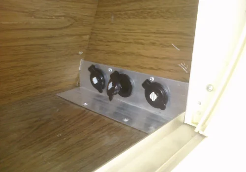 Three added 12V sockets mounted inside an Airstream trailer