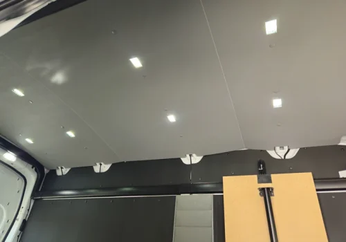 Illuminated LED ceiling lights inside an upfitted cargo van
