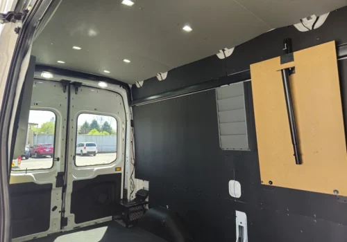Recessed LED lighting illuminating a finished work-van interior