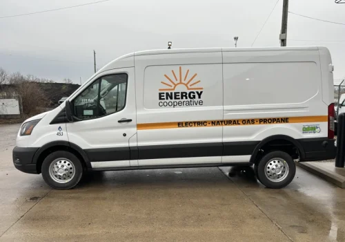 Commercial van with Energy Cooperative logo, lettering and side graphics