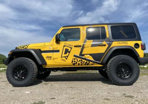 Yellow Jeep with Columbus Crew graphics and custom side decals
